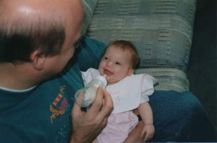 Makenzie smiling with Grandpa Jeff