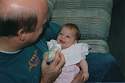 Makenzie smiling with Grandpa Jeff